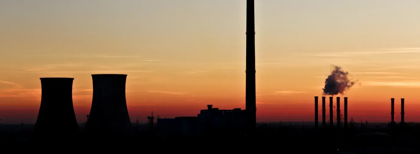 Coal and nuclear plants at night